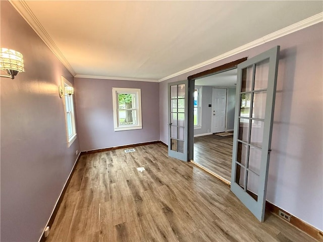 73 E River St, Fayette, NY 13165 - empty room with wood finished floors, ornamental molding, and french doors