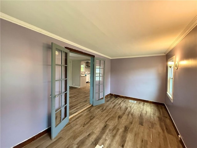 73 E River St, Fayette, NY 13165 - unfurnished room featuring french doors, wood finished floors, and ornamental molding