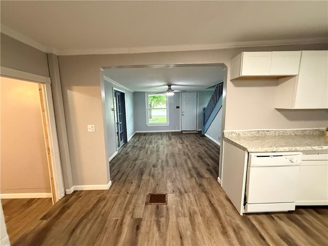 73 E River St, Fayette, NY 13165 - kitchen featuring white dishwasher, ornamental molding, dark wood finished floors, white cabinets, and a ceiling fan