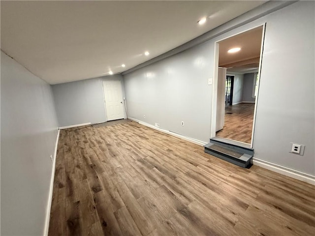 73 E River St, Fayette, NY 13165 - unfurnished living room with wood finished floors and recessed lighting