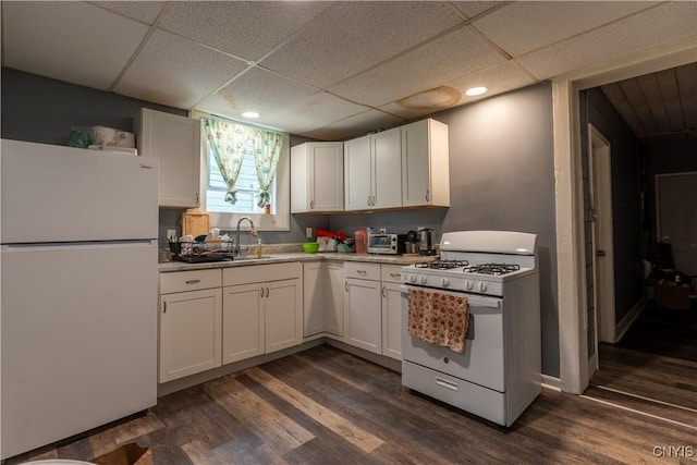 221.5 Lakeview Ave, Syracuse, NY 13204 - kitchen with white appliances, a drop ceiling, white cabinetry, dark wood-style floors, and light countertops