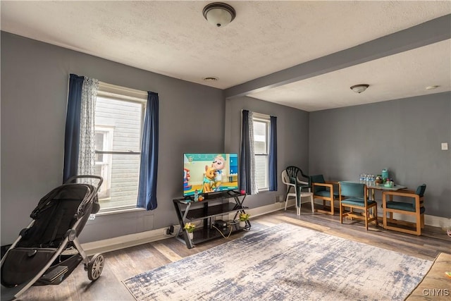 221.5 Lakeview Ave, Syracuse, NY 13204 - home office featuring wood finished floors, a textured ceiling, and beam ceiling