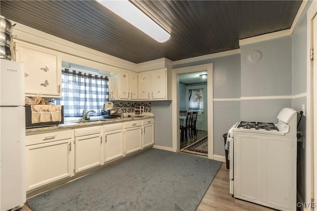 220 Lakeview Ave, Syracuse, NY 13204 - kitchen featuring white appliances, white cabinets, a wainscoted wall, wood finished floors, and wood ceiling