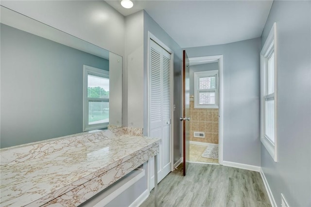 21 Wethersfield Rd, Chili, NY 14624 - bathroom with plenty of natural light and wood finished floors