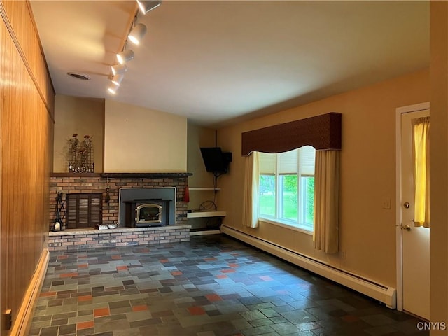 462 Hacadam Rd, Frankfort, NY 13456 - unfurnished living room with a baseboard heating unit and rail lighting