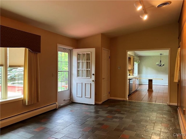 462 Hacadam Rd, Frankfort, NY 13456 - entryway featuring baseboard heating, a chandelier, and rail lighting