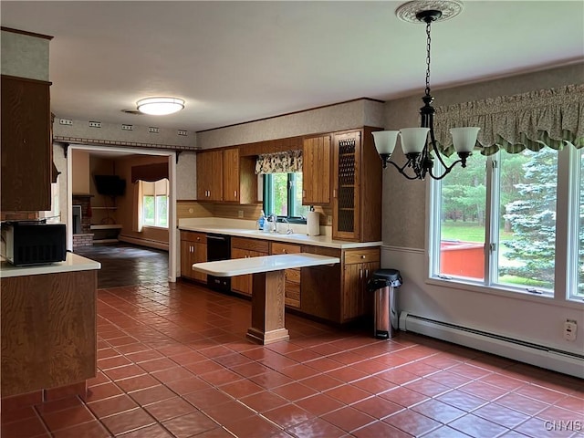 462 Hacadam Rd, Frankfort, NY 13456 - kitchen featuring light countertops, a baseboard heating unit, brown cabinets, tile patterned floors, and a chandelier