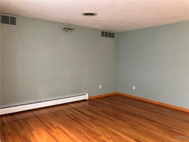 462 Hacadam Rd, Frankfort, NY 13456 - spare room with baseboard heating and wood finished floors