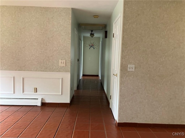 462 Hacadam Rd, Frankfort, NY 13456 - hall featuring a baseboard radiator, wallpapered walls, tile patterned flooring, and a wainscoted wall