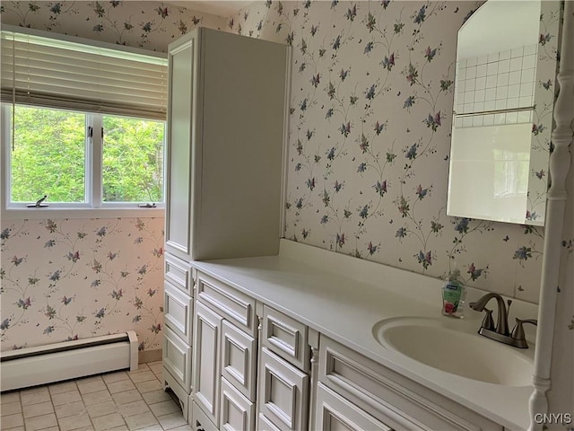 462 Hacadam Rd, Frankfort, NY 13456 - bathroom with baseboard heating, wallpapered walls, vanity, and tile patterned flooring