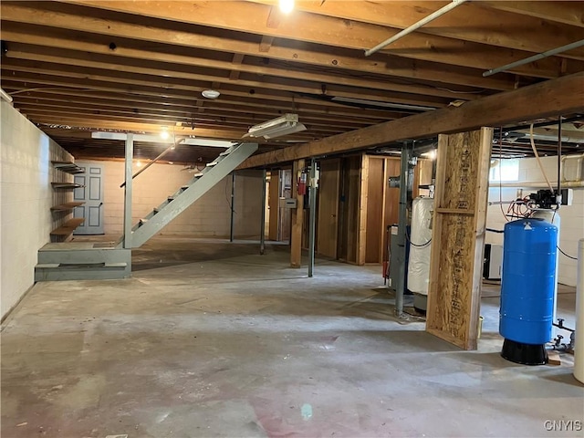 462 Hacadam Rd, Frankfort, NY 13456 - unfinished below grade area with a water pressure tank and stairway