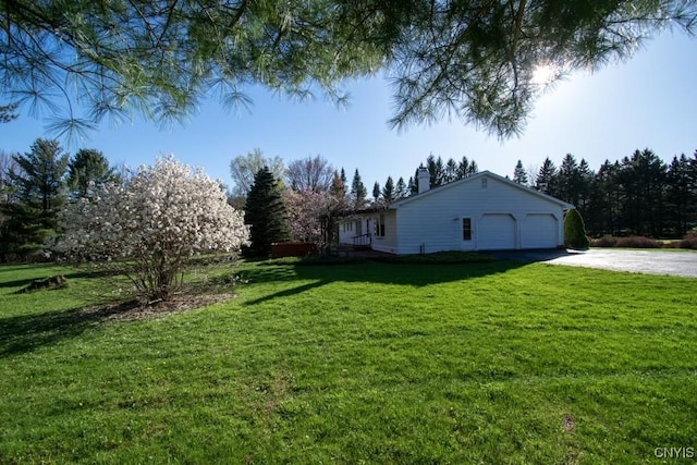 462 Hacadam Rd, Frankfort, NY 13456 - view of grassy yard with driveway and an attached garage
