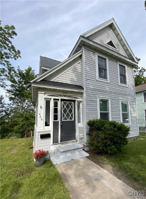 409 W 1st St S, Fulton, NY 13069 - view of front of home with a front yard and entry steps