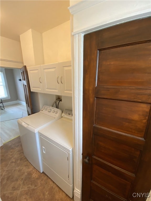 409 W 1st St S, Fulton, NY 13069 - laundry area featuring cabinet space, separate washer and dryer, and tile patterned floors
