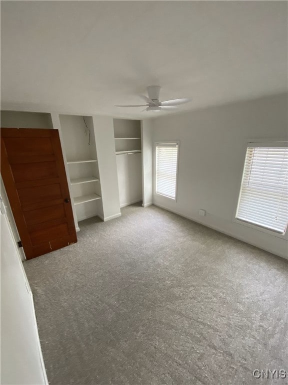 409 W 1st St S, Fulton, NY 13069 - unfurnished bedroom featuring carpet and a ceiling fan