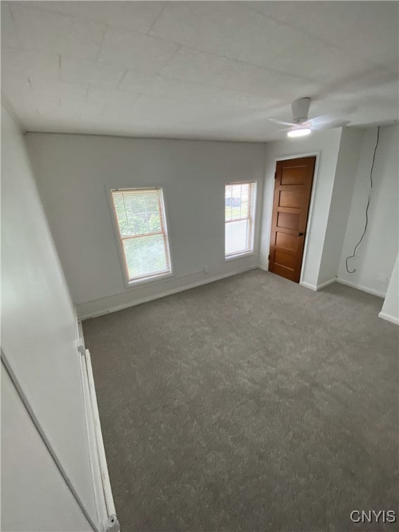 409 W 1st St S, Fulton, NY 13069 - carpeted spare room featuring baseboards and ceiling fan