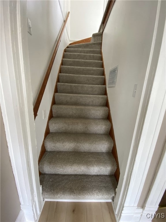 409 W 1st St S, Fulton, NY 13069 - staircase featuring wood finished floors
