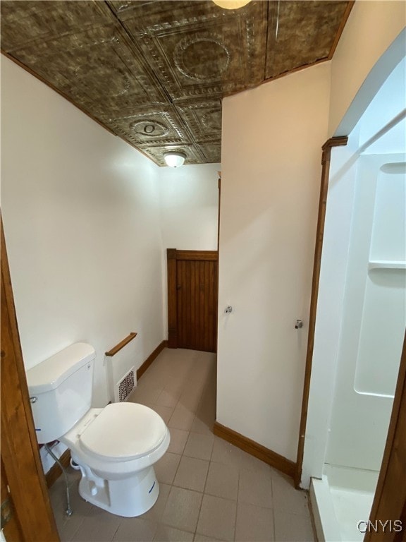 409 W 1st St S, Fulton, NY 13069 - bathroom with an ornate ceiling, a stall shower, and tile patterned flooring