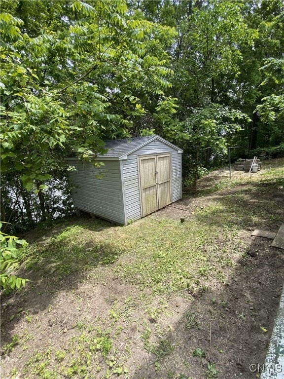 409 W 1st St S, Fulton, NY 13069 - view of yard featuring a storage unit