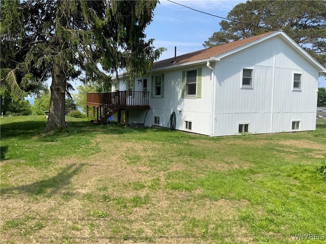 926 Bluff Rd, Carlton, NY 14571 - back of property with stairway, a wooden deck, and a lawn