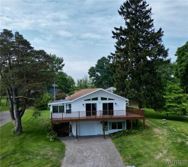 926 Bluff Rd, Carlton, NY 14571 - view of front of house with a garage, a front yard, asphalt driveway, and a wooden deck