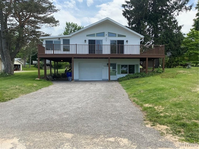926 Bluff Rd, Carlton, NY 14571 - view of front facade with an attached garage, a front yard, a wooden deck, and driveway