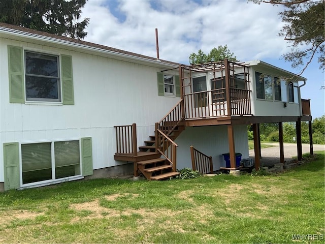 926 Bluff Rd, Carlton, NY 14571 - back of property with stairs, a lawn, and a deck