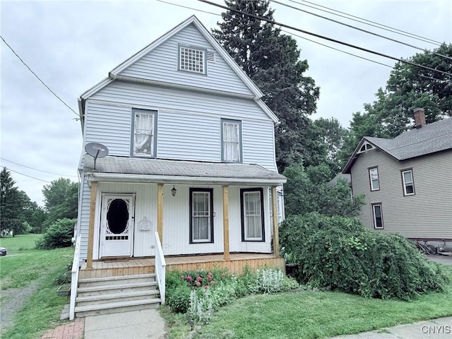 19 Elm Ave, Homer, NY 13077 - view of front facade featuring a porch and a front lawn