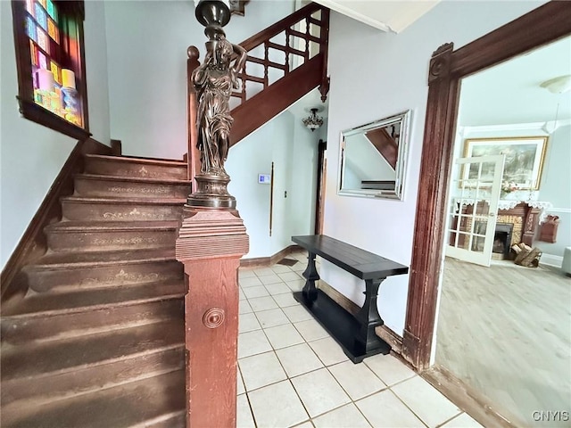 19 Elm Ave, Homer, NY 13077 - stairs featuring tile patterned floors and a fireplace