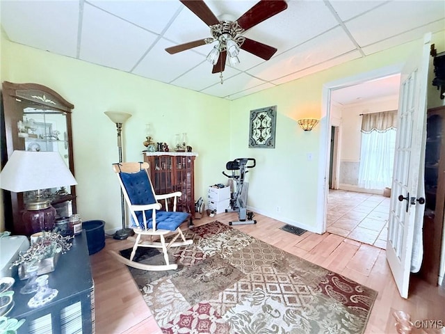 19 Elm Ave, Homer, NY 13077 - sitting room featuring a ceiling fan, a paneled ceiling, and wood finished floors