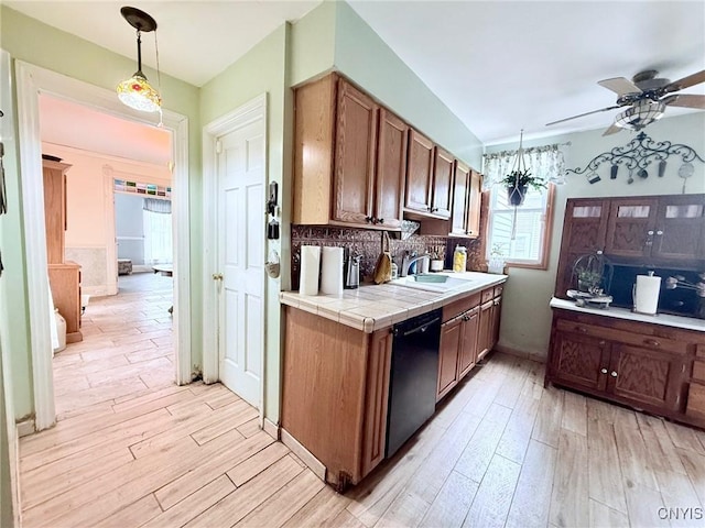 19 Elm Ave, Homer, NY 13077 - kitchen with dishwashing machine, ceiling fan, light wood finished floors, and tile counters