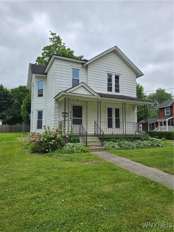 213 Highland Ave, Shelby, NY 14103 - view of front of house featuring a porch