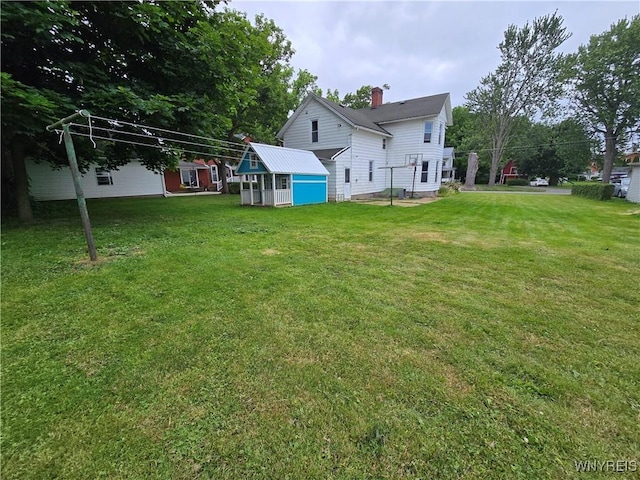 213 Highland Ave, Shelby, NY 14103 - view of green lawn with an outdoor structure