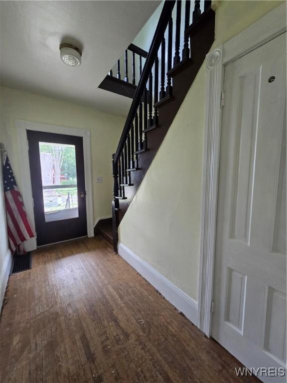 213 Highland Ave, Shelby, NY 14103 - foyer featuring wood finished floors and stairs