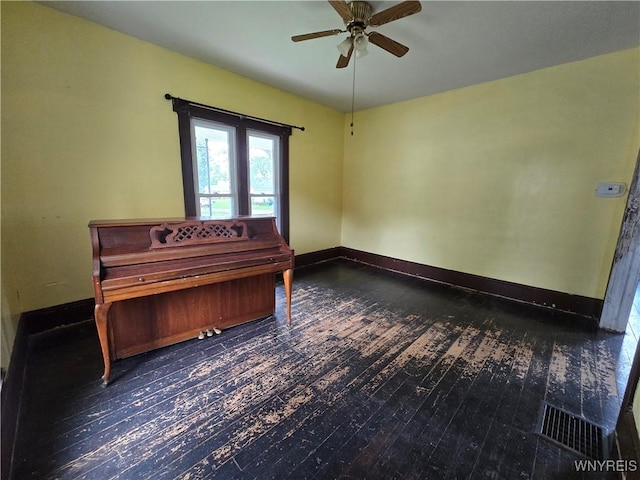 213 Highland Ave, Shelby, NY 14103 - unfurnished bedroom featuring wood-type flooring and a ceiling fan