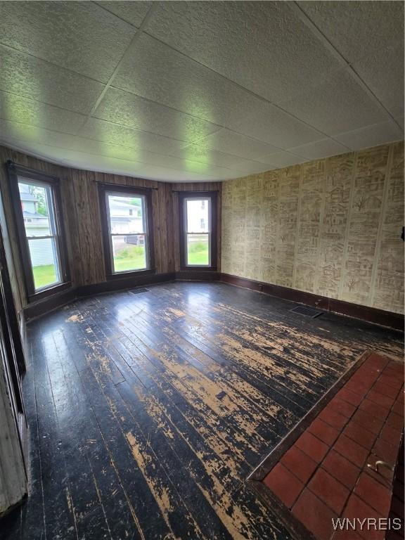213 Highland Ave, Shelby, NY 14103 - unfurnished room featuring wood-type flooring and baseboards