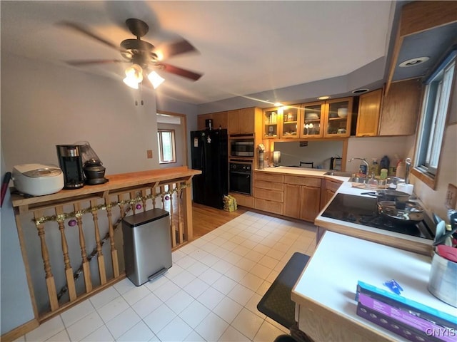 244 Scottholm Ter, Syracuse, NY 13224 - kitchen with black appliances, light tile patterned floors, brown cabinets, and ceiling fan