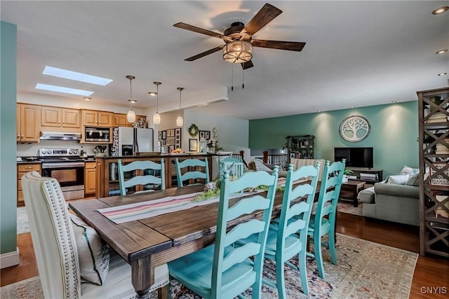 8272 Northgate Dr, Rome-Outside, NY 13440 - dining area featuring a skylight, wood finished floors, ceiling fan, and recessed lighting