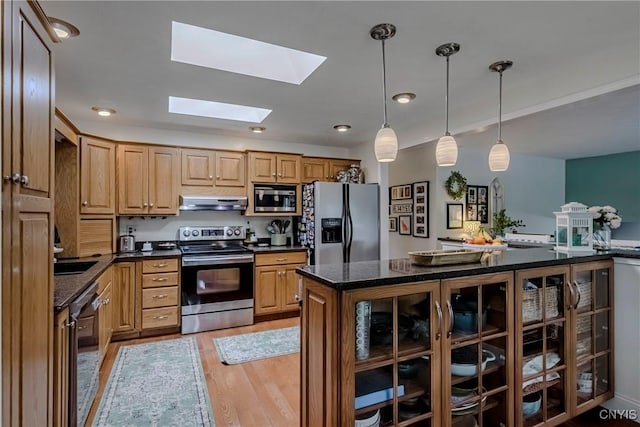 8272 Northgate Dr, Rome-Outside, NY 13440 - kitchen featuring stainless steel appliances, a skylight, light wood finished floors, glass insert cabinets, and ventilation hood