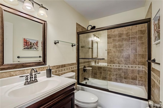 8272 Northgate Dr, Rome-Outside, NY 13440 - full bathroom featuring vanity, combined bath / shower with glass door, tile walls, and wainscoting