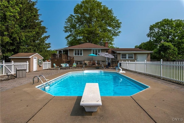 8272 Northgate Dr, Rome-Outside, NY 13440 - view of swimming pool with a diving board, a storage unit, a patio, and a wooden deck