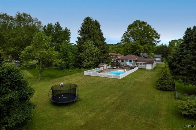 8272 Northgate Dr, Rome-Outside, NY 13440 - back of property with a trampoline and a lawn