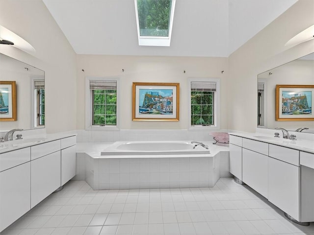 1010 Plank Rd, Penfield, NY 14580 - full bath with a skylight, lofted ceiling, two vanities, and tile patterned flooring