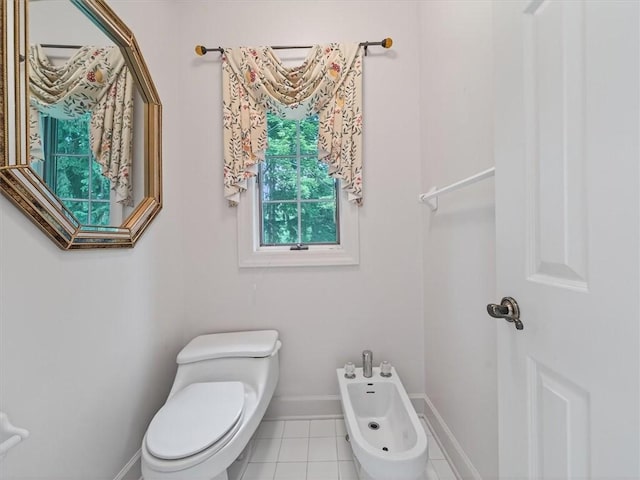 1010 Plank Rd, Penfield, NY 14580 - bathroom with a bidet and tile patterned floors