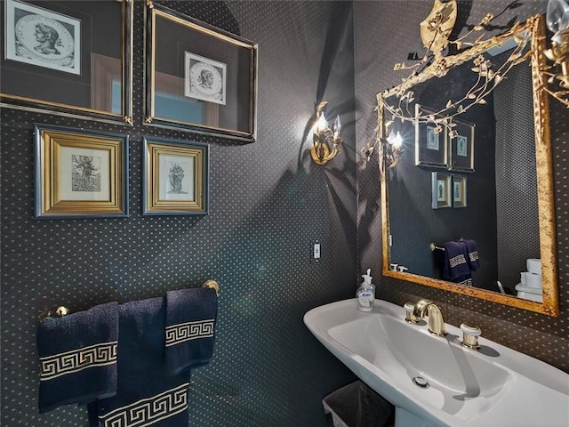 1010 Plank Rd, Penfield, NY 14580 - bathroom featuring a sink and wallpapered walls