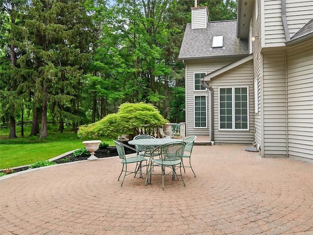 1010 Plank Rd, Penfield, NY 14580 - view of patio featuring outdoor dining space and view of scattered trees