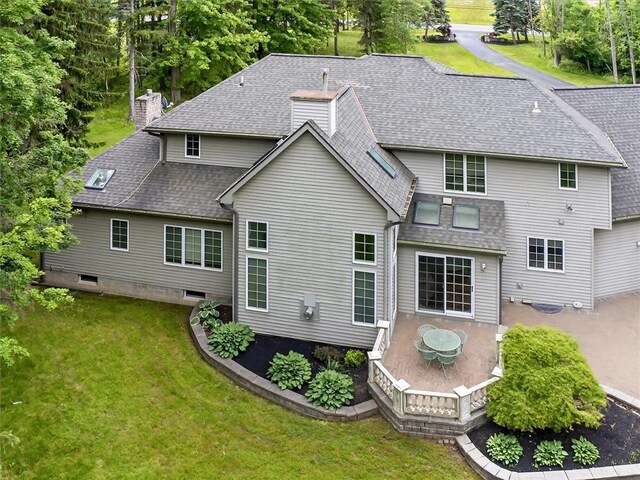 1010 Plank Rd, Penfield, NY 14580 - rear view of property featuring a lawn, roof with shingles, and a chimney