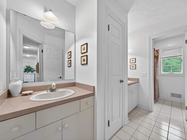 1010 Plank Rd, Penfield, NY 14580 - full bathroom with vanity, tile patterned floors, and a shower with shower curtain