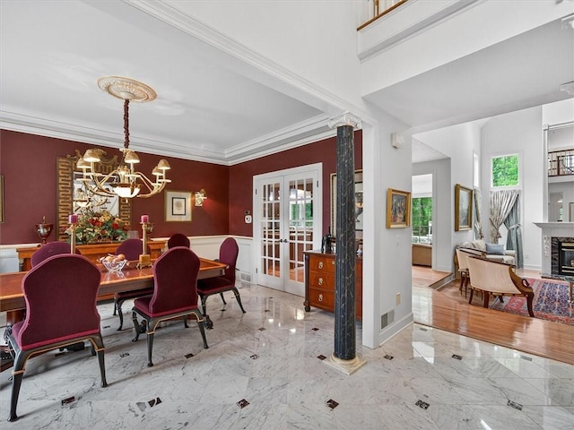 1010 Plank Rd, Penfield, NY 14580 - dining room featuring marble tiled flooring, french doors, a chandelier, crown molding, and a glass covered fireplace