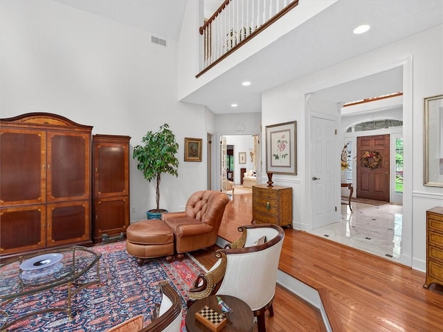 1010 Plank Rd, Penfield, NY 14580 - living area with wood finished floors and a high ceiling